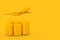 Air Travel Concept. Large Yellow Polycarbonate Suitcases with Yellow Jet Passenger\\\'s Airplane. 3d Rendering