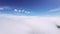 Air view. Flying low above the clouds on an unmanned fpv glider. Cloud surfing. Gliding over a low cloudy surface. cloud