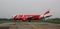 AirAsia airplane on the runway at airport in Jogja, Indonesia