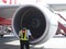 AirAsia ground technician inspecting engine