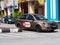 AirAsia Ride Taxi With Promotional Ads Painted On Its Side