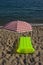 Airbed and sun umbrella on a beach