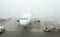 Airbus A320 aircraft of Wizzair airline company in extreme foggy weather causing delayed flights in Katowice, Poland