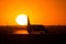 Airbus A320 airplane silhouette in the sun on runway