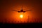 Airbus A320 airplane silhouette at sunset , final approach closeup