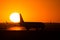 Airbus A320 airplane silhouette at sunset , on runway side view