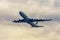 Airbus A340-300 passenger aircraft of the airline Plus Ultra taking off the airport in a foggy day