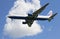 Aircraft Boeing 767-300 EI-DBG of the Transaero airline flies on the background of white clouds