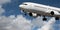 Aircraft closeup in flight with cumulus cloud in blue sky. Australia.