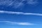 Aircraft contrails on a blue sky