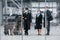 Aircraft crew in work uniform is together outdoors in the airport