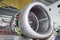 Aircraft engine servicing - opened panels of a large engine of parked aircraft