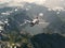 Aircraft flies over a mountains