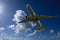 Aircraft in flight with Cumulonimbus cloud in blue sky. Australi