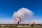 Aircraft fly pass through fire and giant smoke