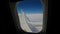 Aircraft flying in clouds airplane Wing and blue sky. Wide footage