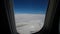 Aircraft flying over clouds. airplane Wing and blue sky. Wide footage