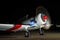 Aircraft with its propeller spinning fast at night