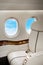 Aircraft (jet) porthole with clouds view