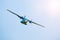Aircraft L 410 Turbolet in flight in blue sky at sunny day in Prague