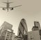 Aircraft landing in London passing over city buildings