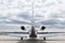 Aircraft learjet Plane in front of the Airport with cloudy sky