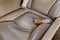 Aircraft leather seat detail with seatbelt with golden buckle