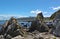 An aircraft makes it`s final approach to Wellington Airport over the rugged coast of the Cook Straits