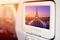 Aircraft monitor in front of passenger seat showing Eiffel Tower and fountain at Jardins du Trocadero at sunrise, Paris