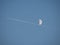 Aircraft and the Moon in the clear sky