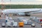 Aircraft parked at the airport, in front of it is a food containers and mobile power supplies. Flight service