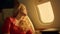 Aircraft passenger travel first class closeup. Tired beautiful blonde dreaming