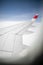 Aircraft porthole with blue sky