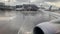 Aircraft's wing and land seen through the illuminator.