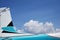 Aircraft Tail Close up with White clouds Background.