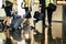 Aircraft team crew boarding scene with captain and hostess assistent fly with luggages reflecting on the floor at the airport gate