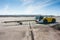 Aircraft tow truck with towbar on the airport apron