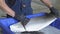 Aircraft turbine. A mechanic washes the turbine blades of the aircraft engine.