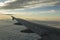 Aircraft wing over the clouds