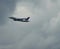 Aircrafts of Singapore Airlines after take-off during the flight under the dense cloud cover