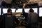 Aircrew members flying airplane with dashboard command