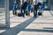 Aircrew members with travel suitcases walking in airport terminal