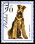 Airedale Terier in a vintage, canceled post stamp