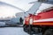 Airfield fire truck extinguishes aircraft after emergency landing in a cold weather