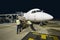 Airfreight loading onto BAE-146 at night.