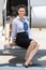 Airhostess Sitting On Ladder Of Private Jet