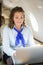 Airhostess Using Laptop In Private Jet