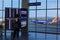 Airline passenger examines flight data in airport terminal
