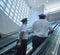 Airline pilots on the way to plane inside airport