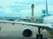 Airliner airplane closeup on tarmac with air traffic control tower in background